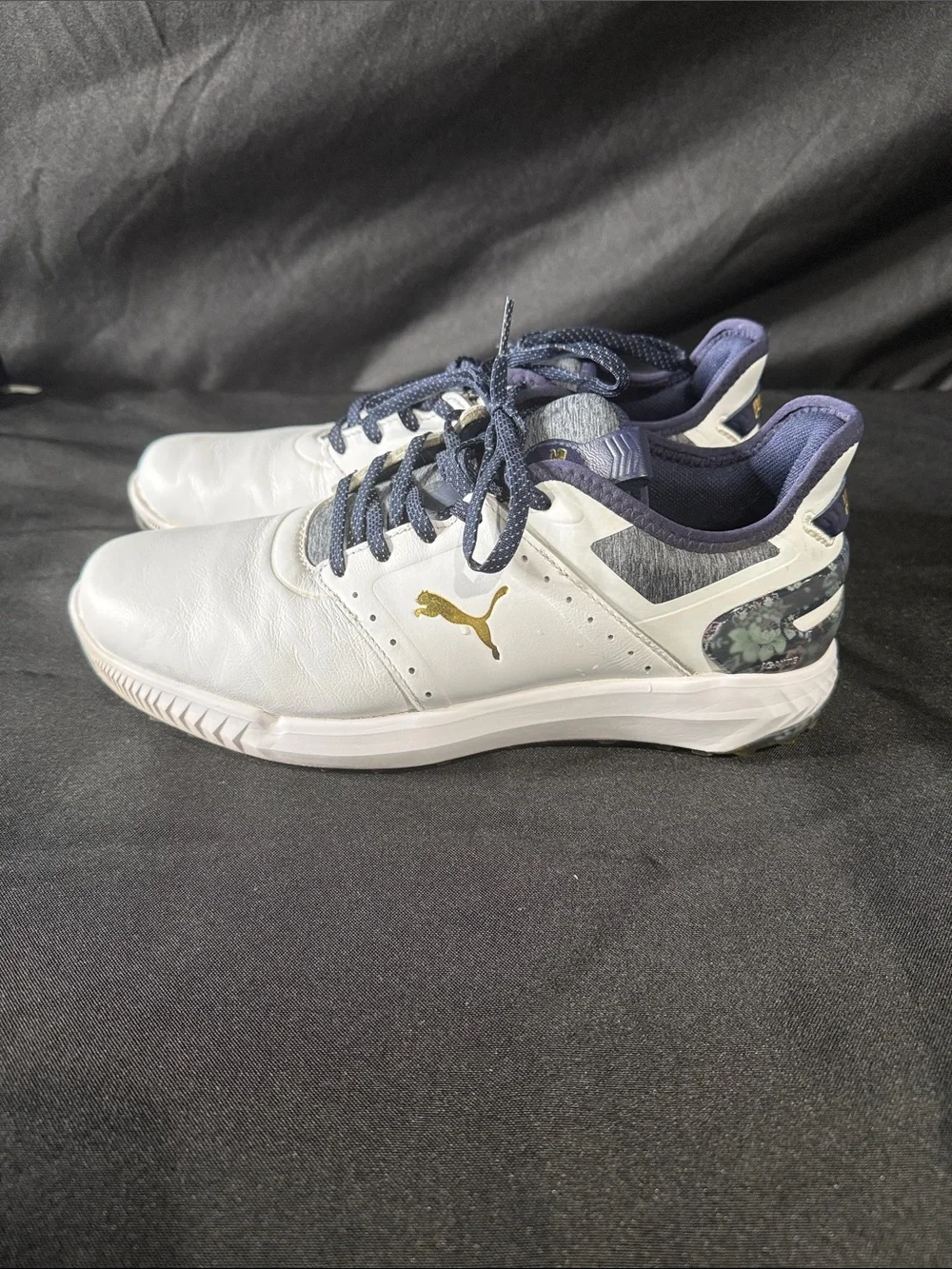 Puma men’s White and Navy Athletic Golf Shoes with Gold Logo